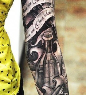 Black arm's bottle tattoo