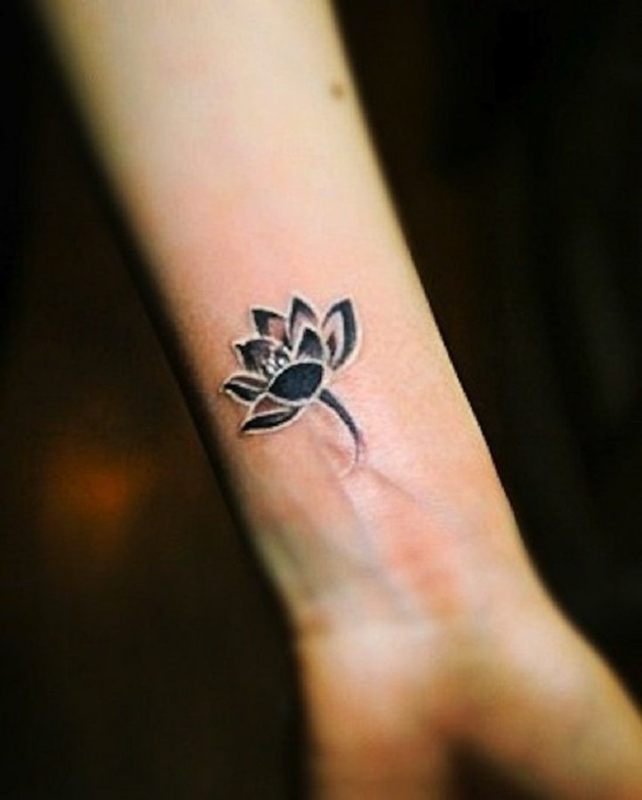 Black flowers wrist tattoo