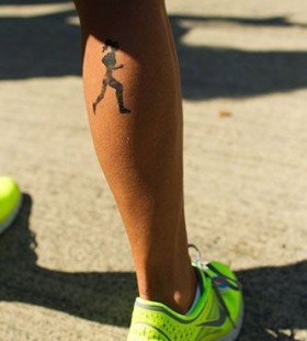 Black girl's leg's sport tattoo