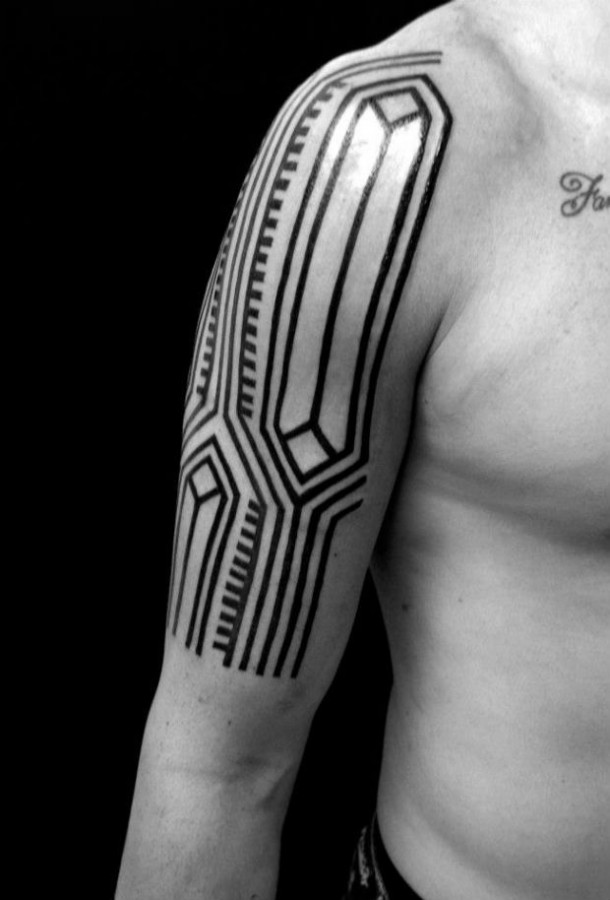 Black ink arm tattoo by Brian Gomes