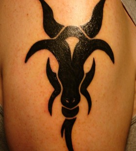 Black ink goat tattoo