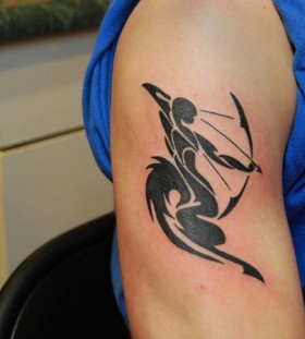 Black ink sagittarius arm tattoo