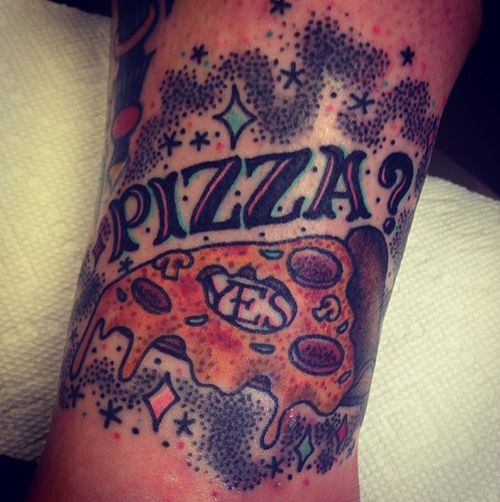Black letters and pizza tattoo