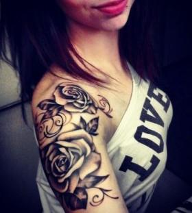 Black roses girl's shoulder tattoo