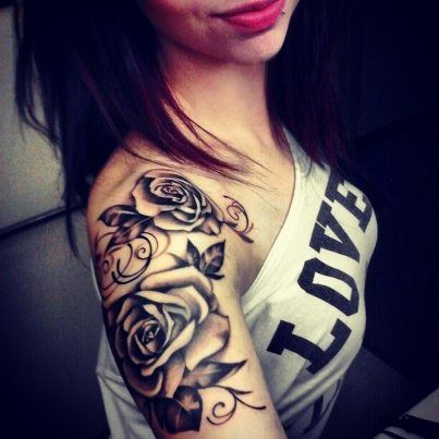 Black roses girl’s shoulder tattoo