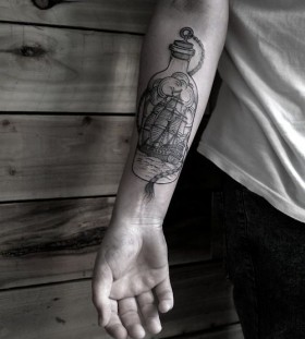 Black ships arm's bottle tattoo