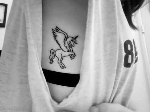 Black simple unicorn tattoo