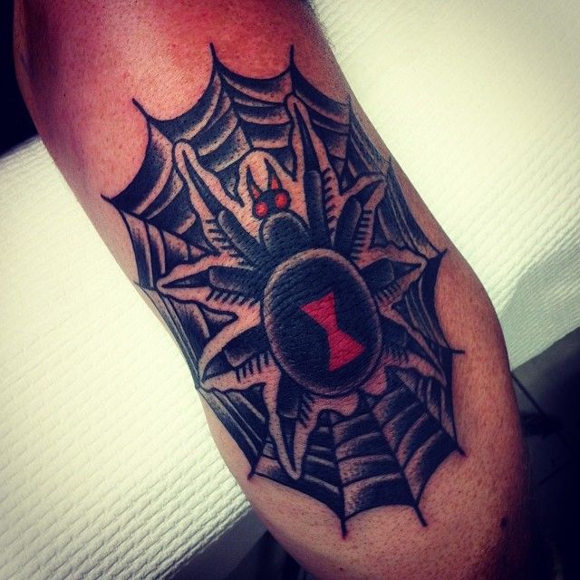 Black spider tattoo by Charley Gerardin