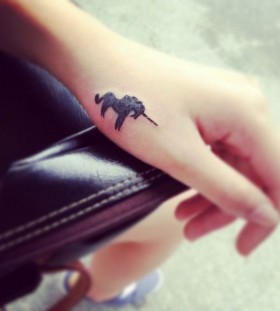 Black wrist unicorn tattoo