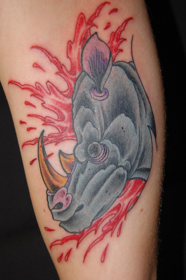 Bloody rhino arm tattoo