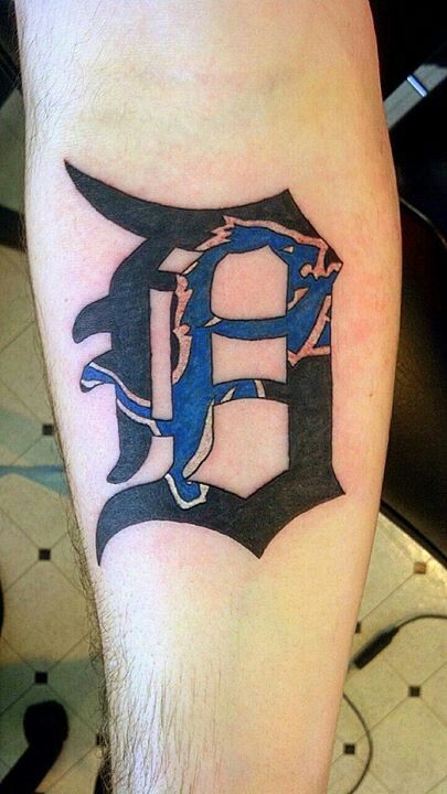 Blue and black sport tattoo