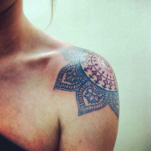Blue and red shoulder tattoo