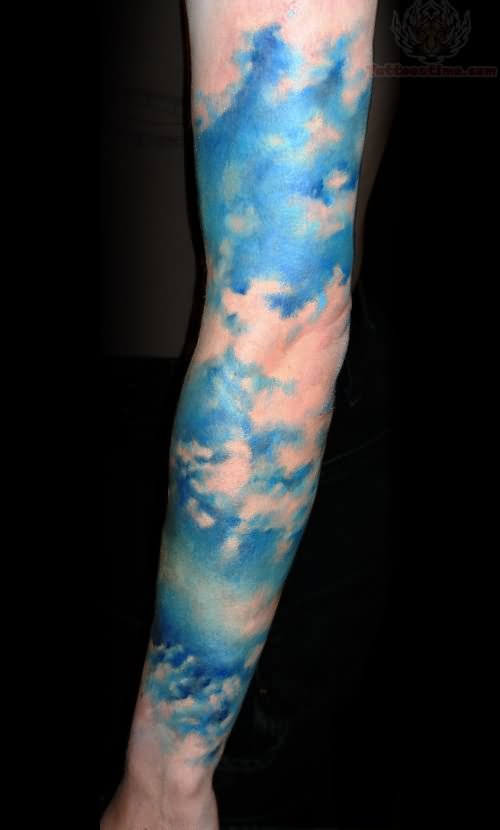 Blue clouds arm tattoo