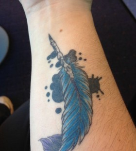 Blue feather pen tattoo