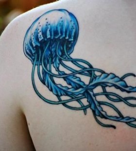 Blue jellyfish back tattoo