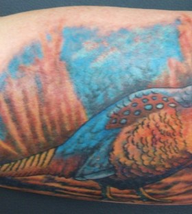 Blue pheasant arm tattoo