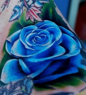 Blue rose tattoo by Kyle Cotterman