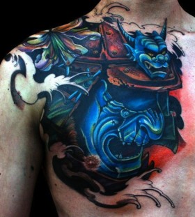 Blue samurai mask chest tattoo