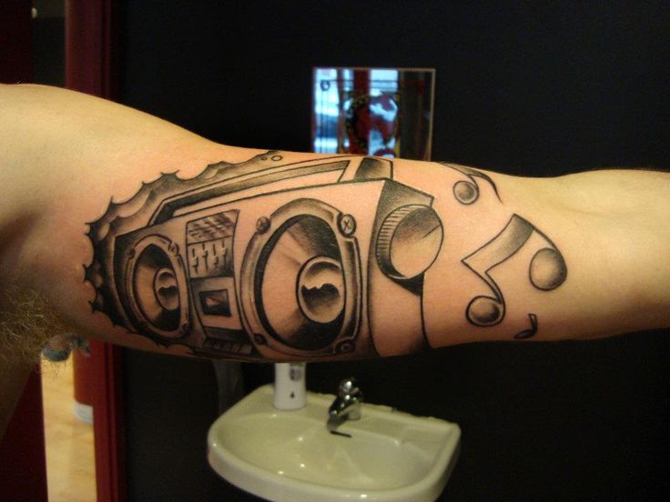 Boombox and music notes tattoo