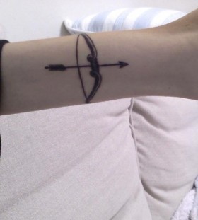 Bow and arrow arm tattoo