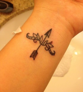 Bow and arrow wrist tattoo