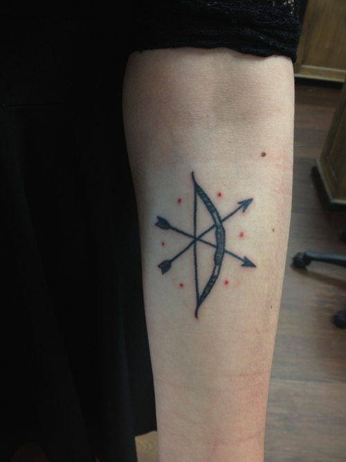 Bow and crossed arrows tattoo