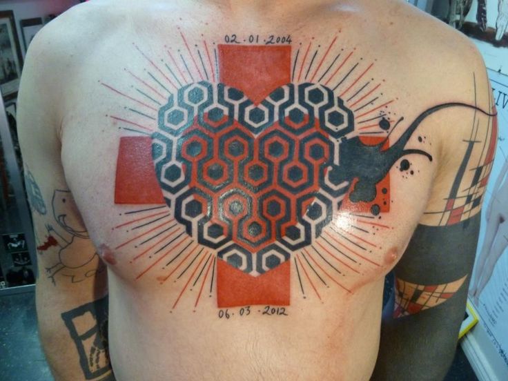 Brilliant chest tattoo by Yann Black