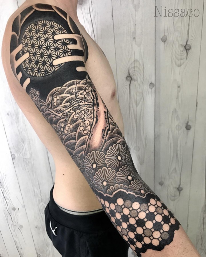 brilliant sleeve tattoo by nissaco