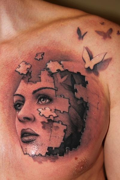 Brilliant woman puzzle tattoo by Riccardo Cassese
