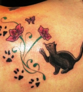 Cat paws and flowers tattoo