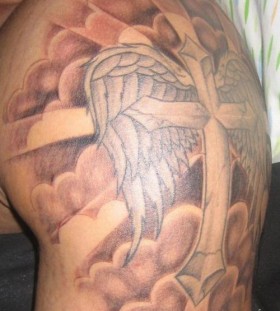 Clouds and cross with wings tattoo