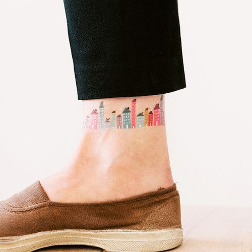 Colorful leg’s town tattoo