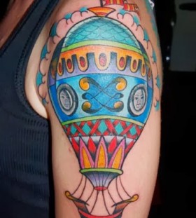 Coloured air balloon arm tattoo