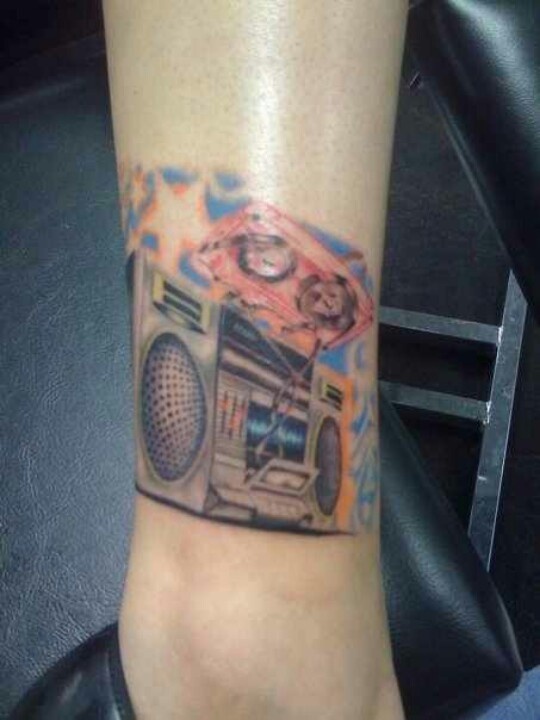 Coloured boombox leg tattoo