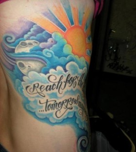 Coloured clouds side tattoo