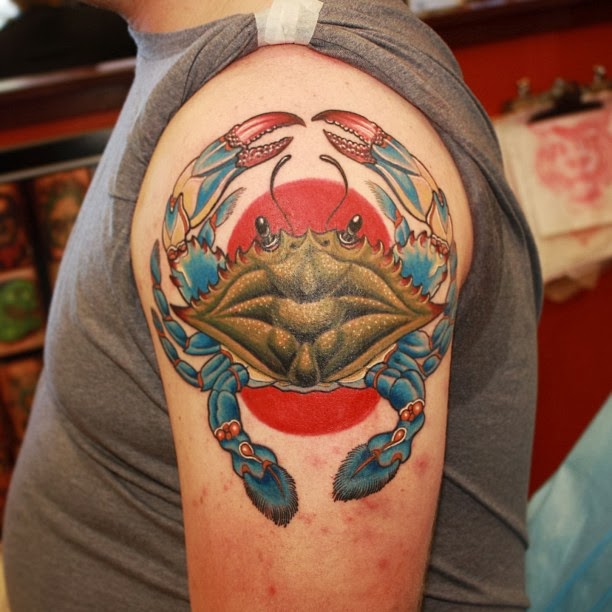 Coloured crab arm tattoo
