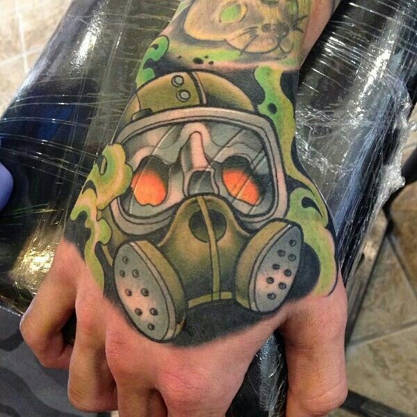 Coloured gas mask hand tattoo