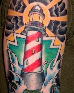 Coloured lighthouse arm tattoo