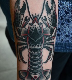 Coloured lobster arm tattoo