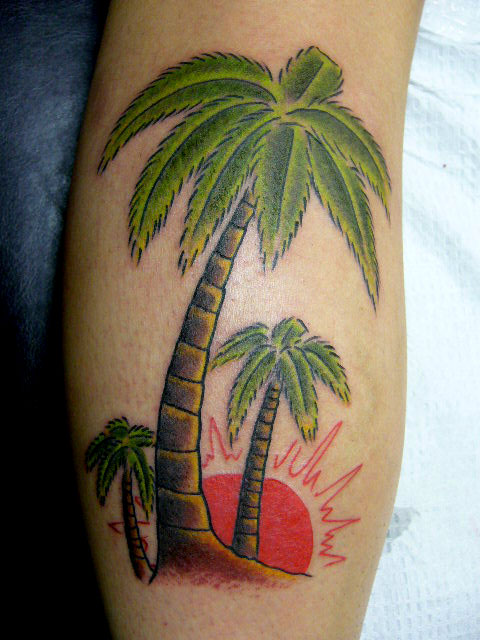 Coloured palm tree arm tattoo