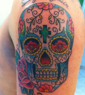 Coloured skull and roses tattoo