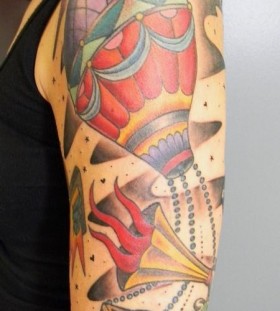 Colourful air balloon arm tattoo