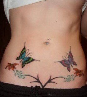 Colourful butterflies stomach tattoo