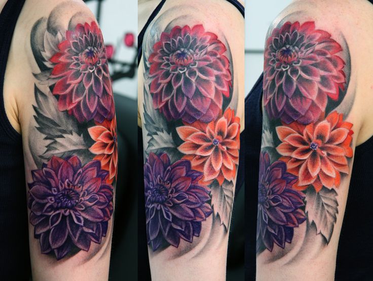Colourful dahlias arm tattoo