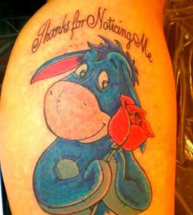 Colourful eeyore and quote tattoo