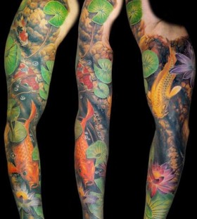 Colourful fish full arm tattoo by James Tattooart