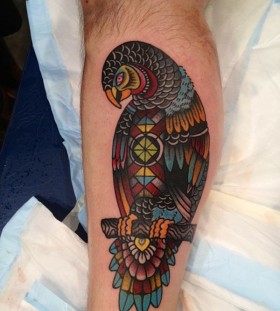Colourful geometric parrot tattoo