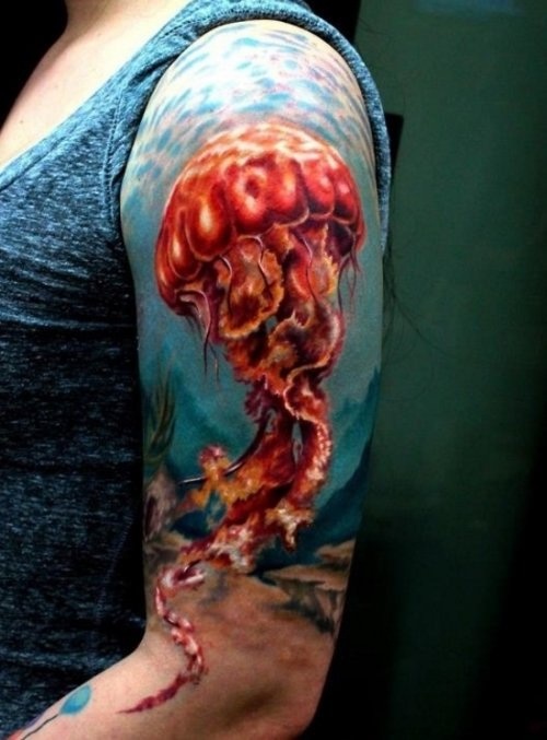 Colourful jellyfish arm tattoo