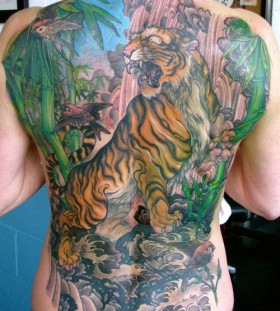 Colourful jungle back tattoo