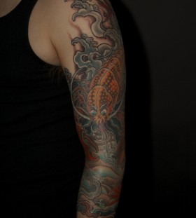 Colourful lobster arm tattoo
